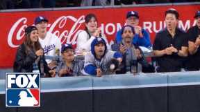 Fan interferes at World Series and reaches for ball at the wall in Yankees vs. Dodgers